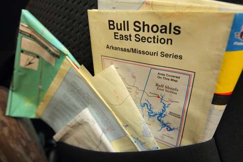 <p>His truck's back seat holds many lake maps. </p>
