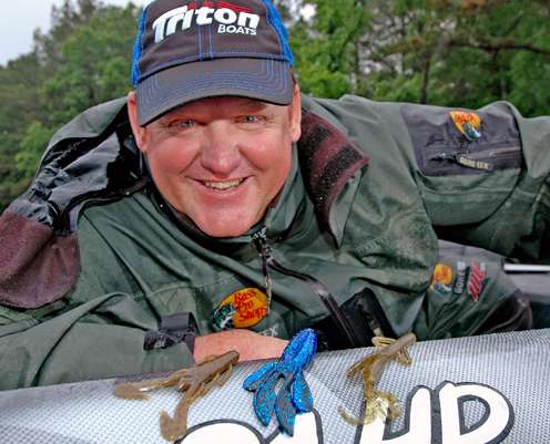 <p>Kenyon Hill is all smiles above his three top jig trailers, all made by Zoom. They include the Ulta Vibe Speed Craw, Z-Hog and Baby Brush Hog.</p>
