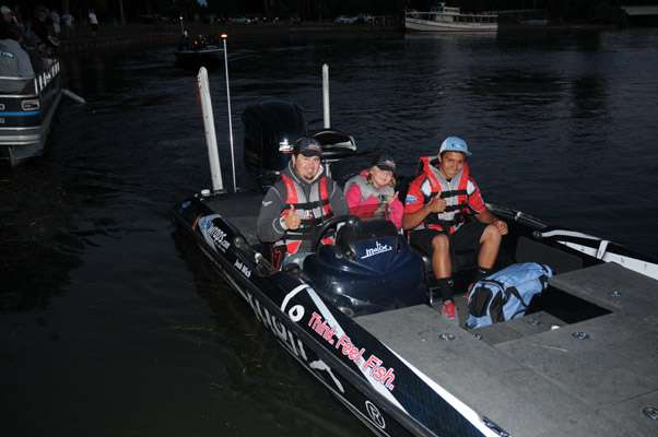 <p>Delaware juniors Devon Braune and Hailey Wich with boat captain Josh Wich.</p>
