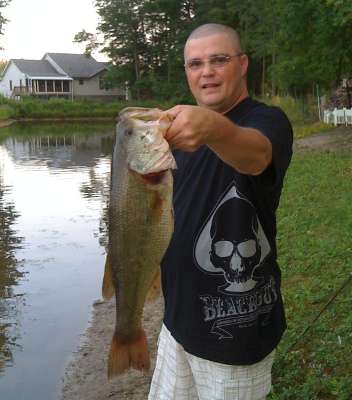 <p>"I caught this in 2009 in a retention pond behind my house," said Jon DeBlasi. "I was using a Rapala SR5 (silver). Did not weigh it. Didn't have a scale with me. All I had was a pole and my brother to take a pic."</p>
