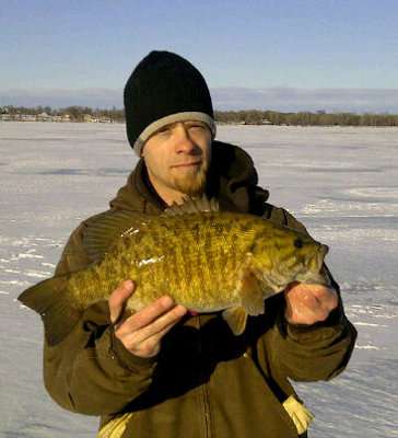 <p>Marcus Schmieg caught this 4-13 smallie in Campbells Slough, S.D. "I caught it on a tip-up with a jig and live chub in winter 2012," said Schmieg.</p>
