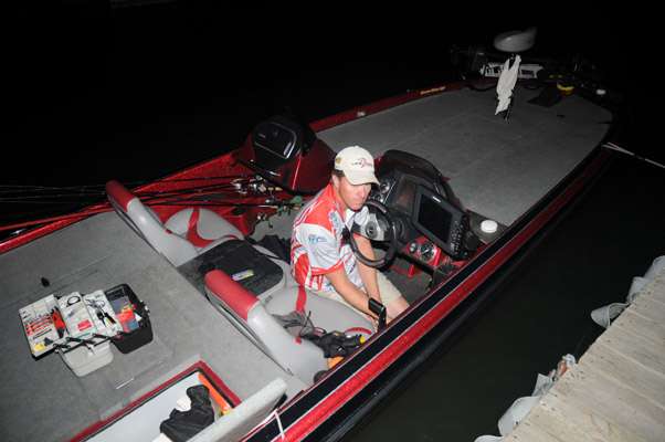 Troy Lee does some early morning maintenance on his boat.