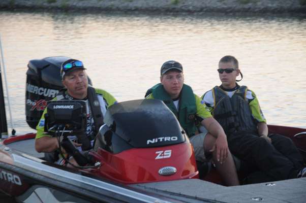 Iowa juniors Riley Bunge and Clay Torson with boat captain Rod Bunge.