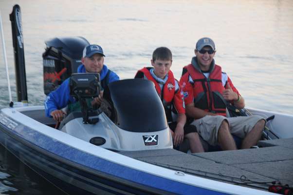 Wisconsin juniors Kyler Chelminiak and Steve Niemi Jr. with boat captain Steve Niemi Sr.