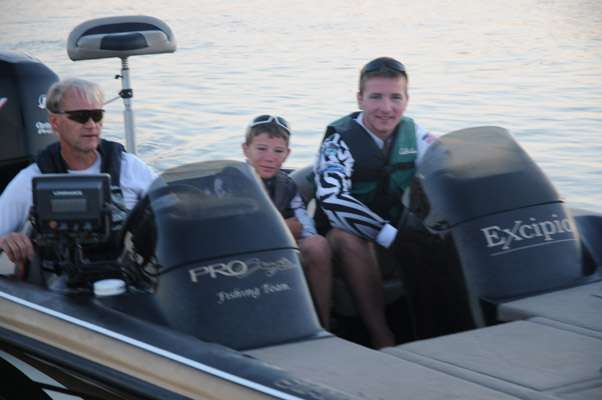 Minnesota juniors Neil Molitor and Roman Chapman with boat captain Jeff Gilmer.