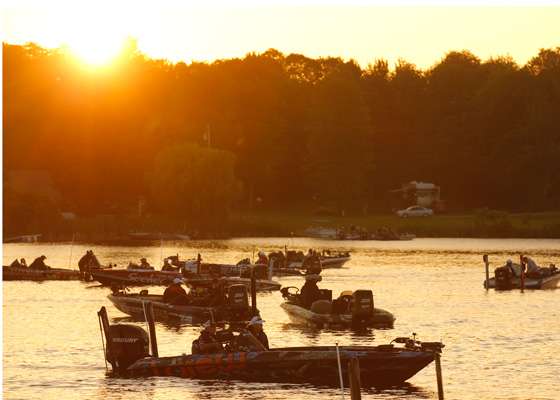 <p>As the sun peaks over the trees, Elite anglers get their gear ready for the start of the Evan Williams Bourbon Showdown at St. Lawrence River.</p>
