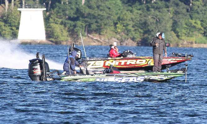<p>Kevin VanDam speeds downriver, while Cliff Pace studies his electronics near the main channel of the St. Lawrence River.</p>
