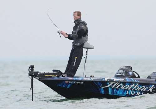 <p>Brandon Card casts as he makes a drift along a reef on Lake Erie.</p>
