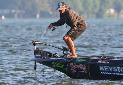 <p>Chris Zaldain manages to hook a fish despite the crowded conditions. </p>
