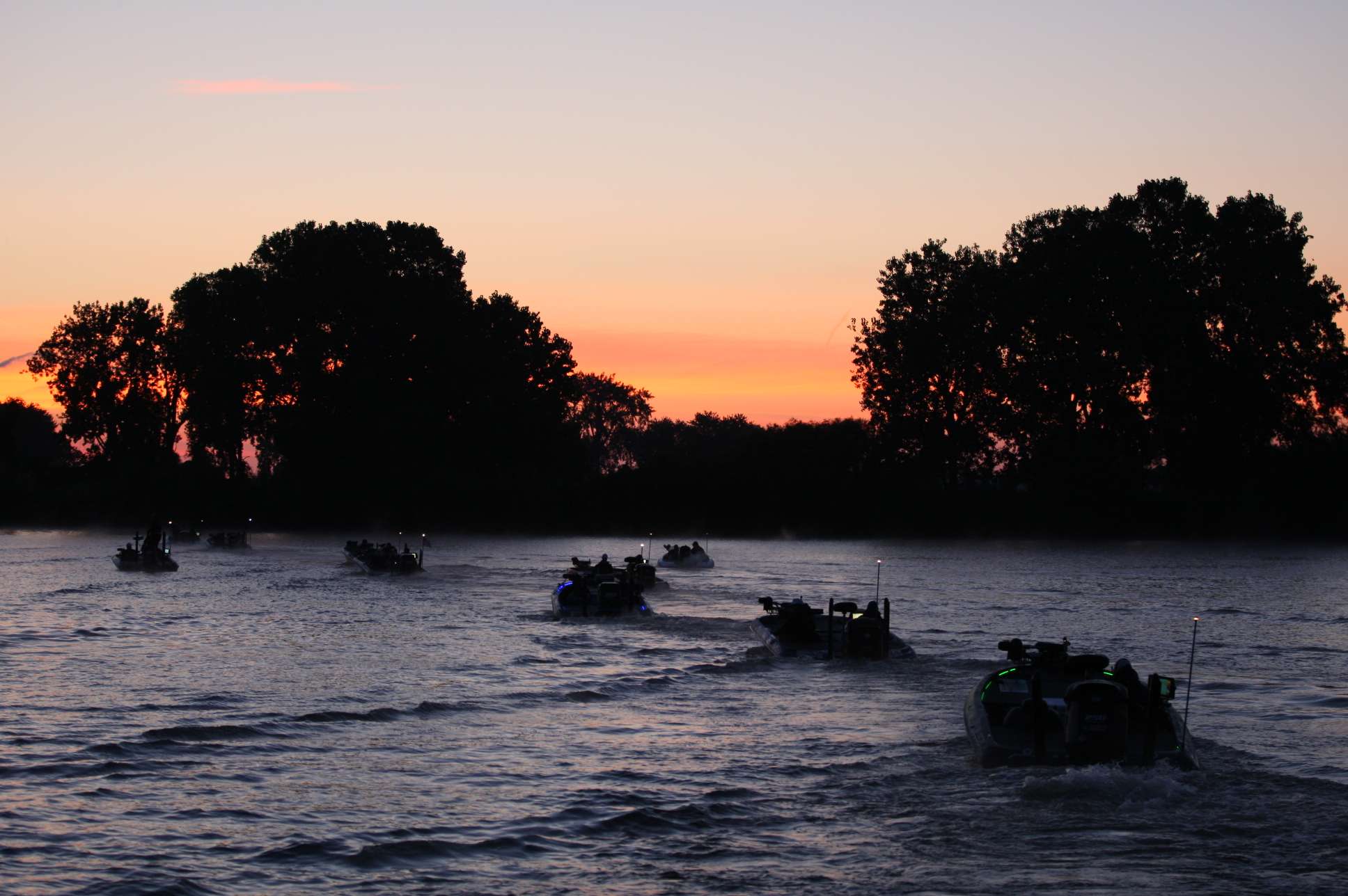 Boats line up as dawn breaks. 