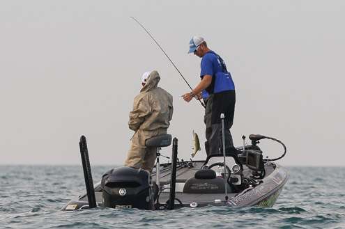 <p>The overcast sky continues and Greg Vinson just lands a short fish.</p>
