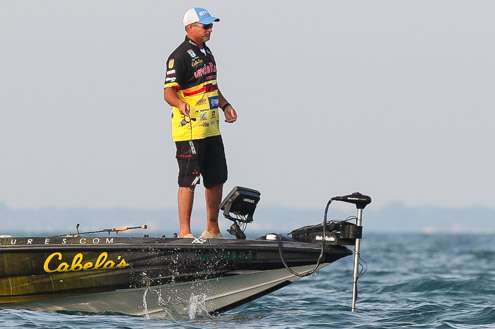 <p>Jeff Kriet slaps his bait on the surface to remove grass.</p>
