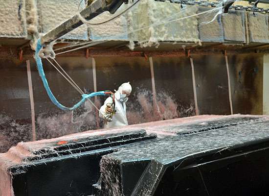 <p>This worker sprays the majority of the âglass onto the hull.</p> 