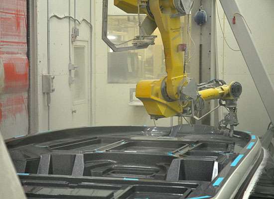 <p>A robot cuts the compartments out of the hull.</p> 