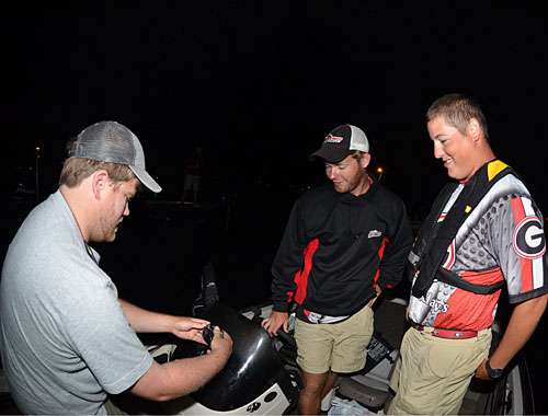 <p>B.A.S.S. staffer Shaye Bake affixes a GoPro camera to the boat of Georgiaâs Byron Kenney and Brian Rosso.</p>
