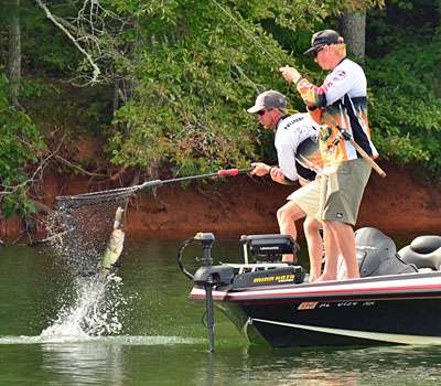 <p>The bass landed straight in the net as Nummy lifts it aboard.</p>
