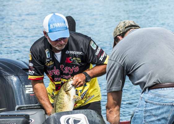 <p>Jeff Kreit unloads his catch after a strong Day One.</p>
