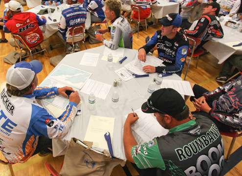 Anglers lay out their briefing sheets and maps as the Elite Series meeting begins. 
