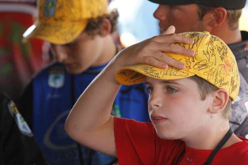 Young volunteer with autographed hat.