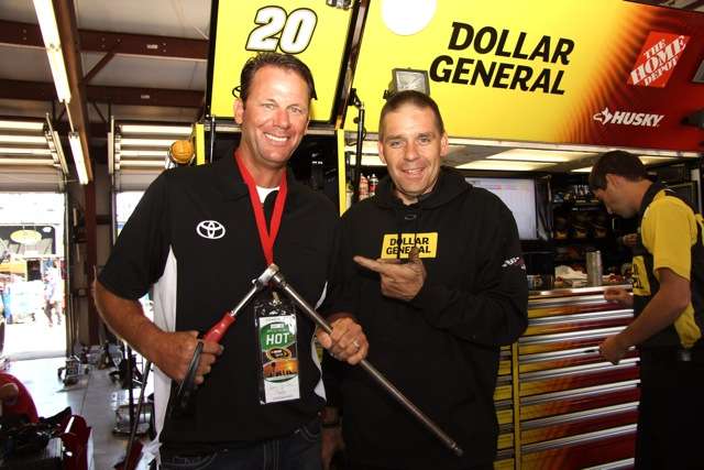 Kevin jokes with Jason Shapiro, avid angler and Car Chief for the No. 20 Dollar General Toyota Camry that won the rain-delayed race several hours after this photo was taken.