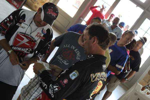 Our honorary game warden, Kevin VanDam, checks to make sure all participants have valid fishing licenses.