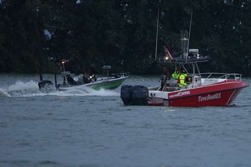 Competitors open the throttle as they pass by the Tow BoatUS vessel.