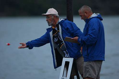 B.A.S.S. staff member Bruce Mathis tosses a numbered FOB to each competitor.