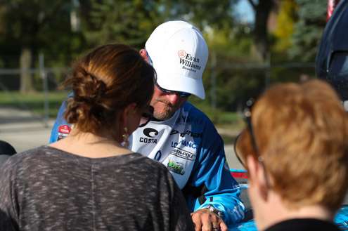 Hank Cherry signs some shirts.