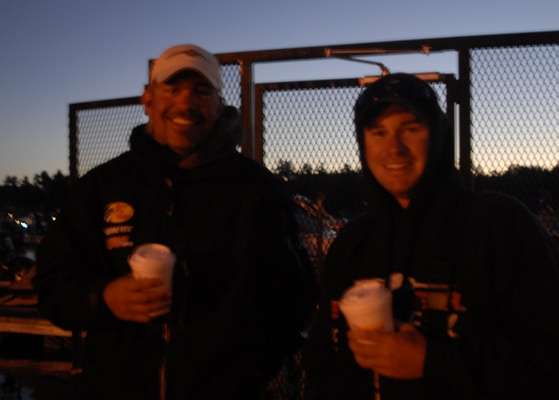 Chris Killoren of New York and Chris Molineaux of Rhode Island have some coffee before getting in the boat.