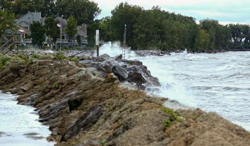 Wind and waves crash a seawall along Lake Erieâs south shoreline. 