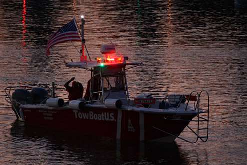 The Tow Boat US vessel lights up the bay with its emergency flashers.