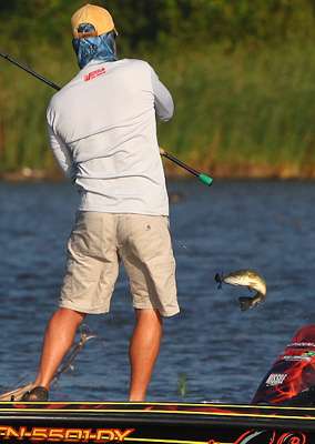  Chad Morgenthaler pulls a fish into the boat.