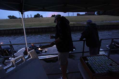B.A.S.S. staffers stay dry as they inspect boats and inform competitors of their check-in time.