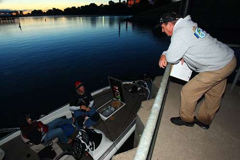 Tournament director Chris Bowes talks with E.P. Fletcher in boat No. 12.