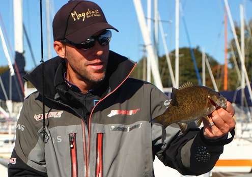 Martens takes a look at the smallmouth before releasing it.