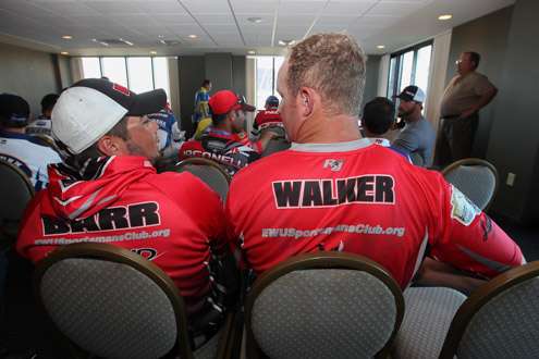 Walker and Barr have found their seats. Dave Mercer is about to talk to the college anglers.
