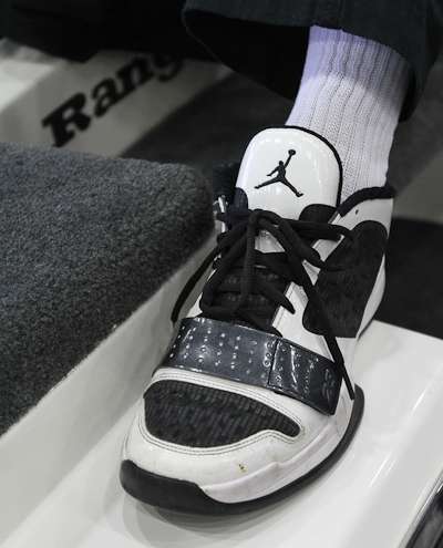 <p>Which angler sports black and white Air Jordans?</p>
