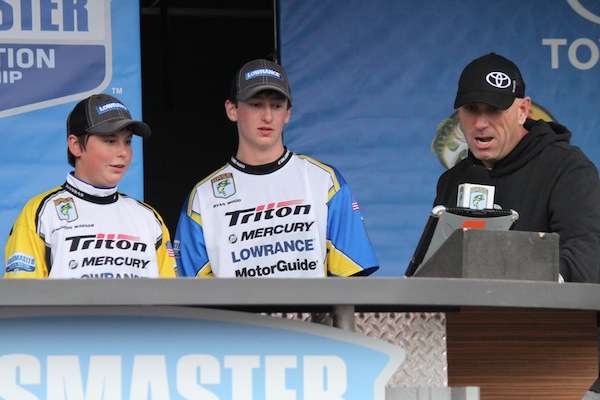 Two anglers standing in the 11-to-14 division. 
