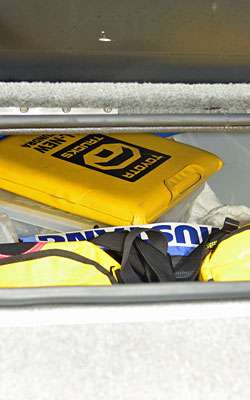 Further up in the box are a seat cushion and Mustang PFD.