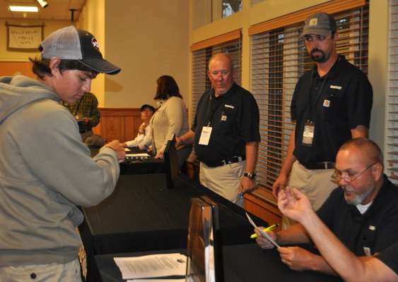 After making some progress on his boating safety certification, Chagollan brings up the rear in the registration line.
