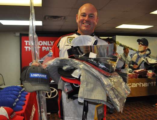 Coby Carden of Alabama was the first to make it all the way through line, and he could barely carry all of his sponsor gear, which included Carhartt jackets and pants.