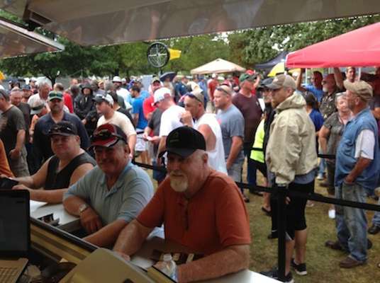 Anglers waiting in the rain to sign up for the event.