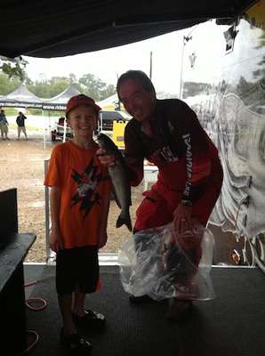 Nathan Brookman weighs in a 3.60 catfish on Day 1 in the rain.