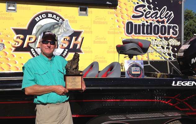 Winner Don Atchley with his trophy and Legend Boat.