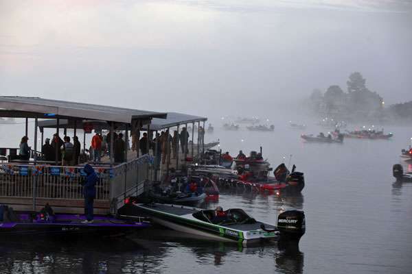 Hot coffee and conversation are the word around the dock during the fog delay. 