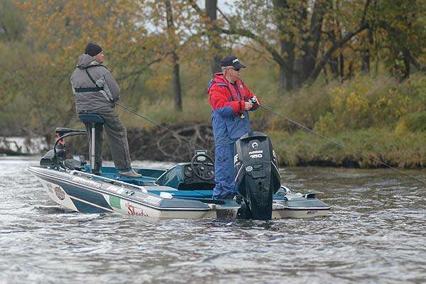 A Bass Trek team casts swimming jigs tight to the bank.