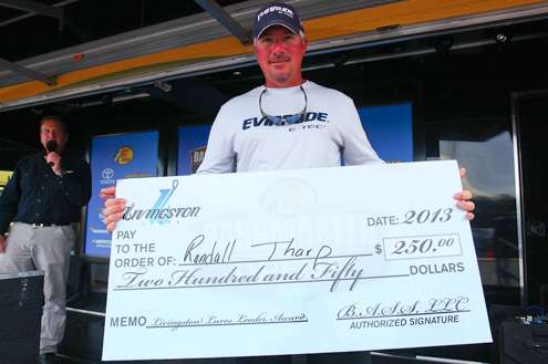 Randall Tharp shows off his $250 check from Livingston Lures.