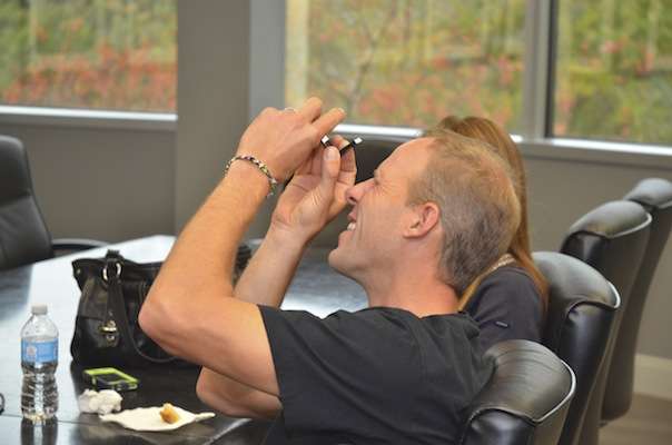 <p>Martens checks out a slide that his mother, Carol Martens, sent to <em>Bassmaster</em> Magazine for an article. <em>Bassmaster</em> editors had requested photos of him fishing as a child, and his mom had lots of pictures to choose from.</p>