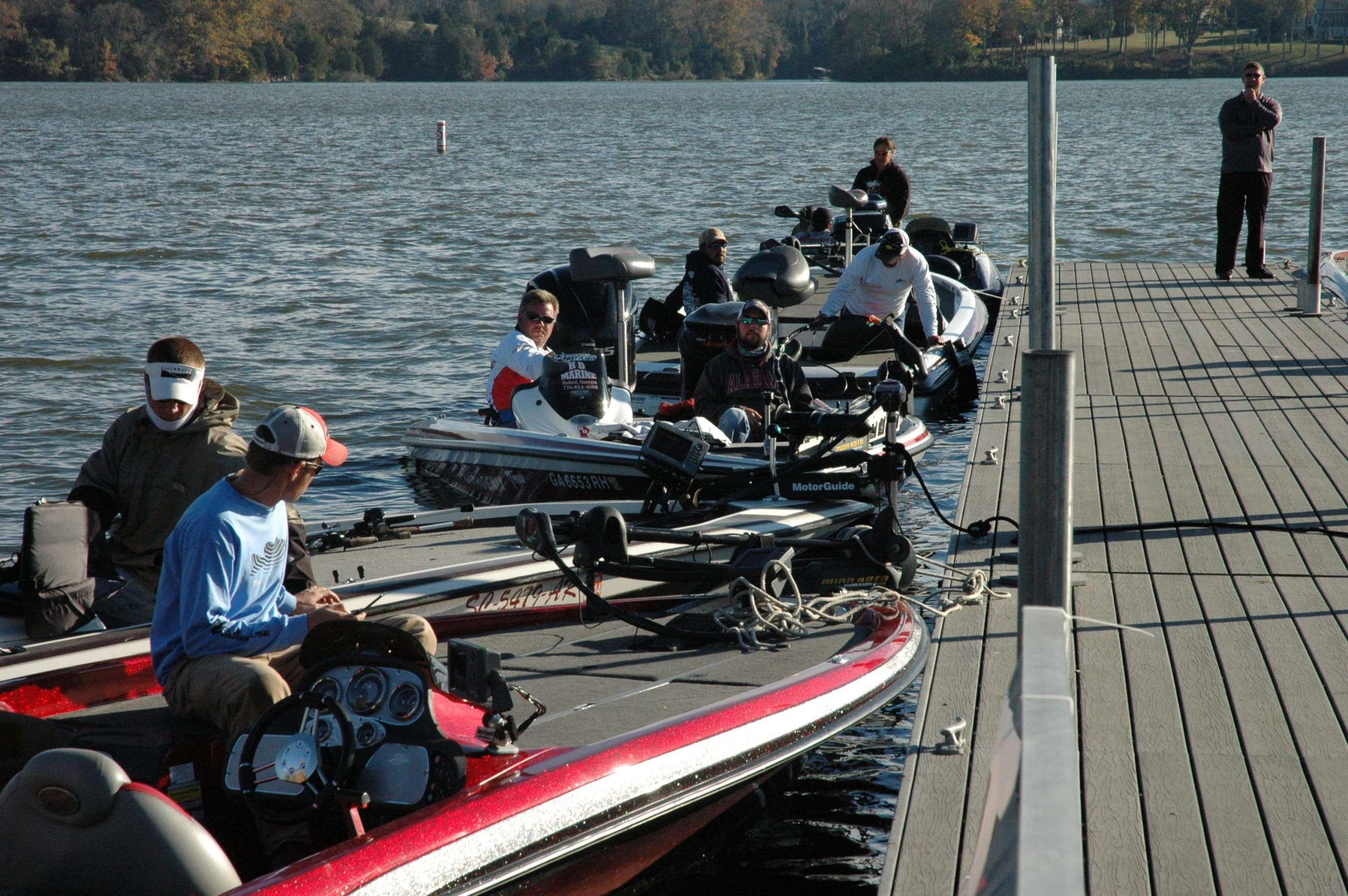 Anglers stow their tackle and wait for the weigh-in to begin. 