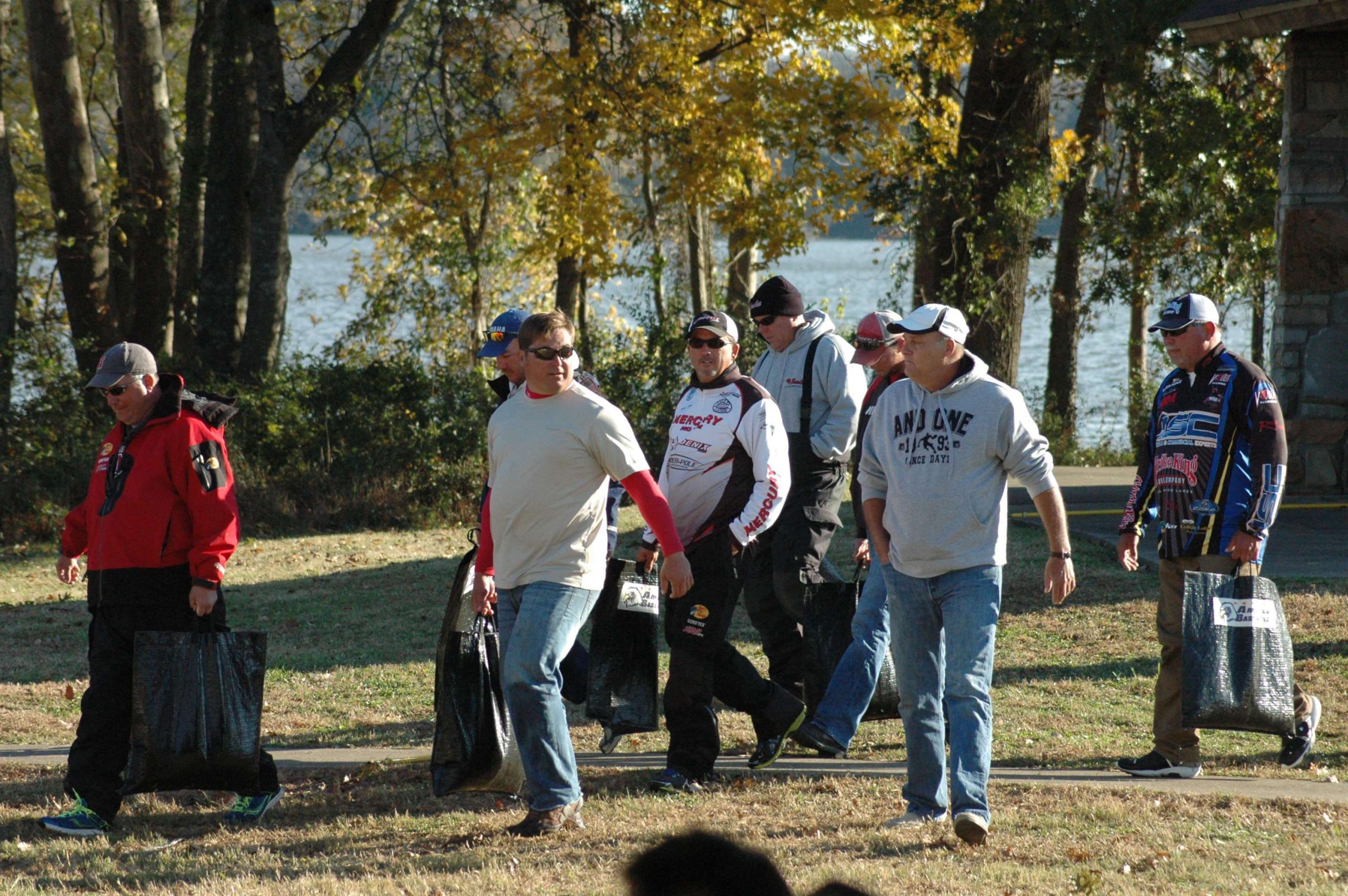 The first group of anglers makes the walk from the docks to the weigh-in tent. 